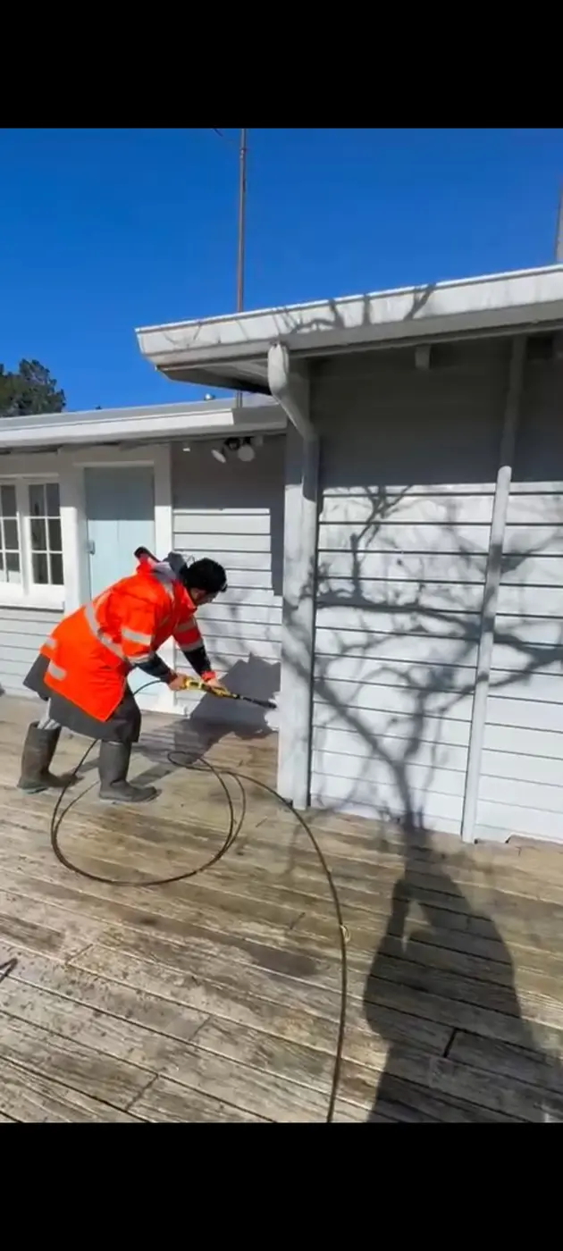 Exterior cladding being professionally washed