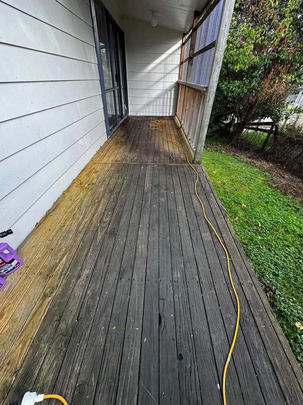 Weathered timber deck before cleaning