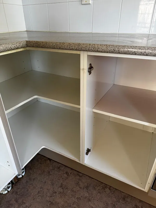 Kitchen cabinet cleaning Auckland — corner cabinet interior spotless after cleaning