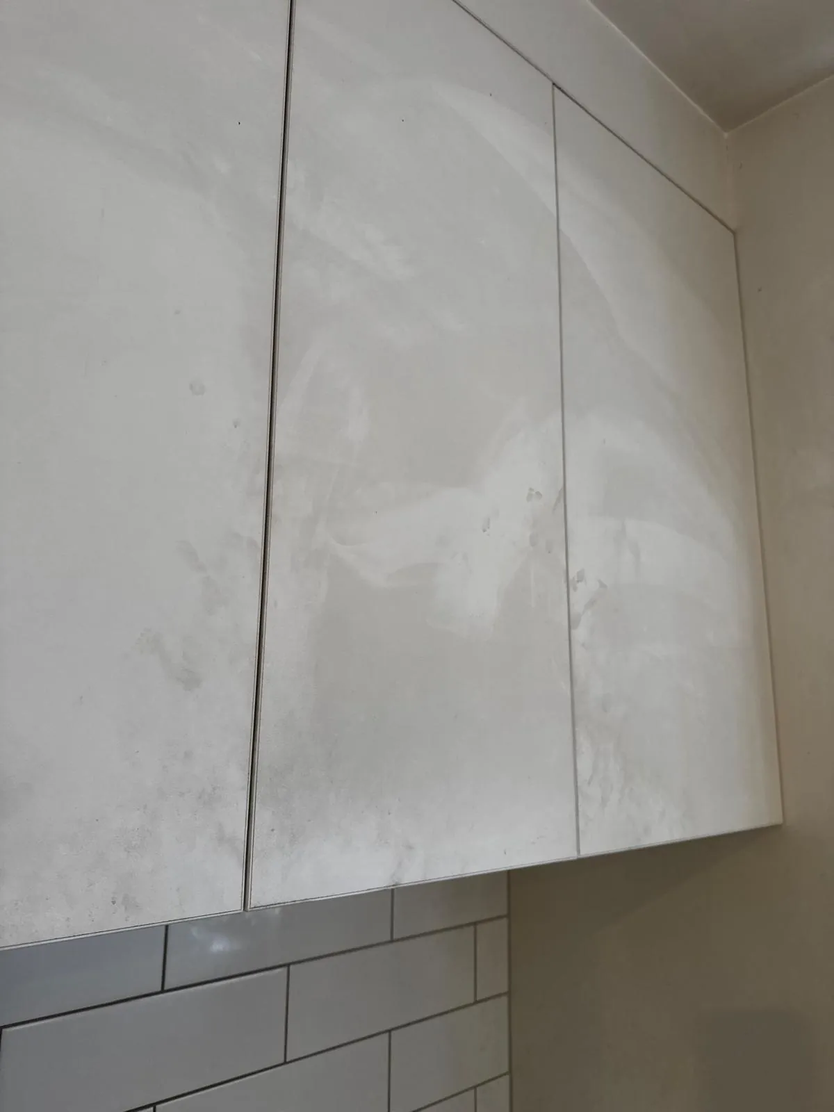Kitchen cabinet cleaning Auckland — smudged cabinet doors before cleaning