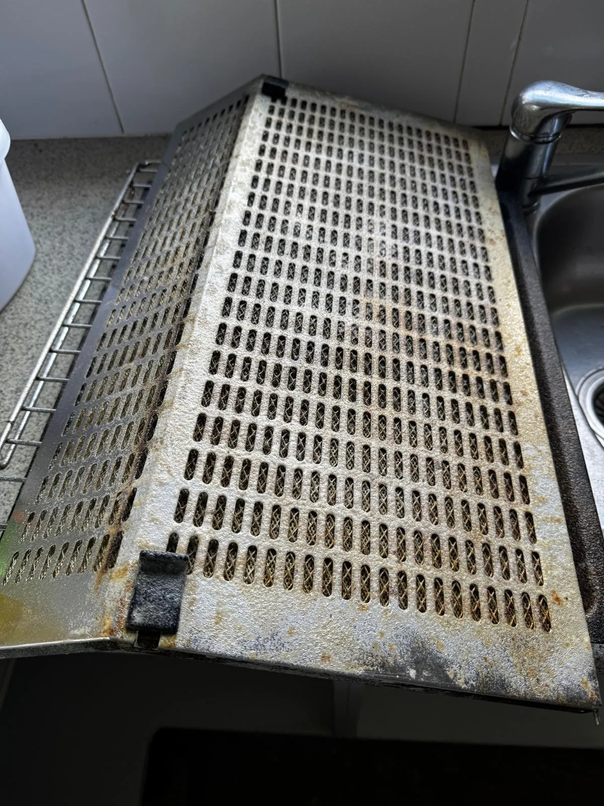 Rangehood filter degreasing Auckland — grease-clogged filter before cleaning