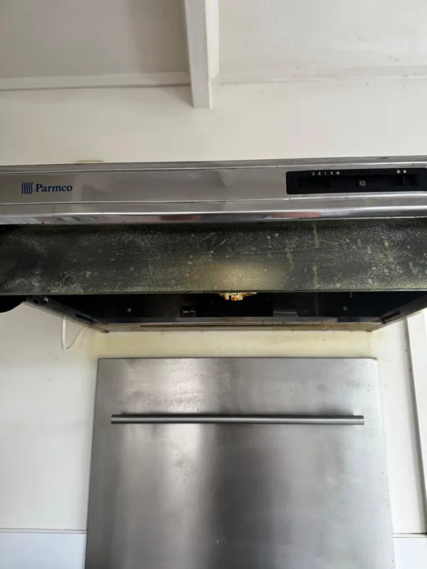 Rangehood deep cleaning North Shore — grease-saturated mesh filter removed for degreasing