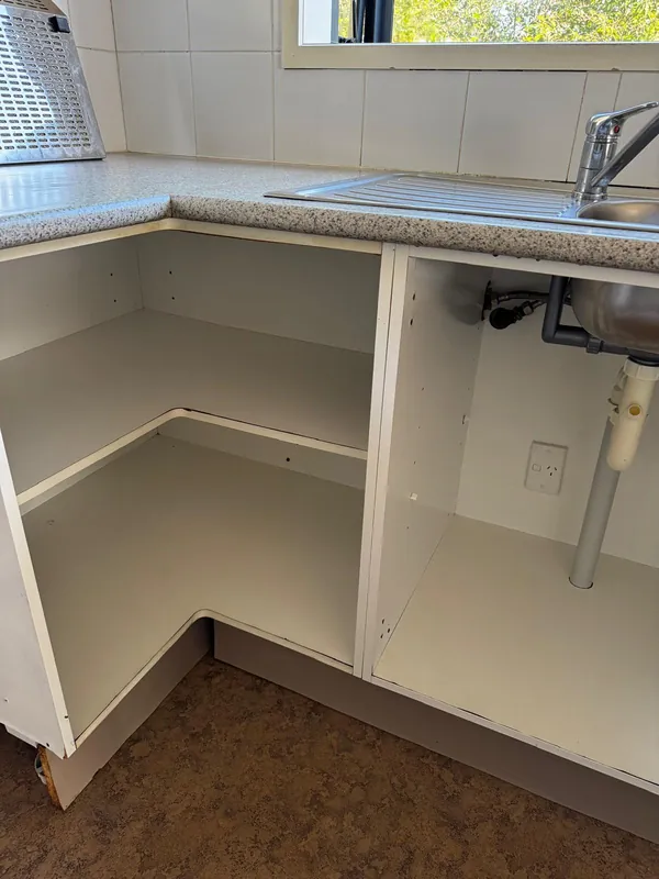 End of tenancy kitchen cleaning Auckland — under-sink cabinet cleaned and sanitised